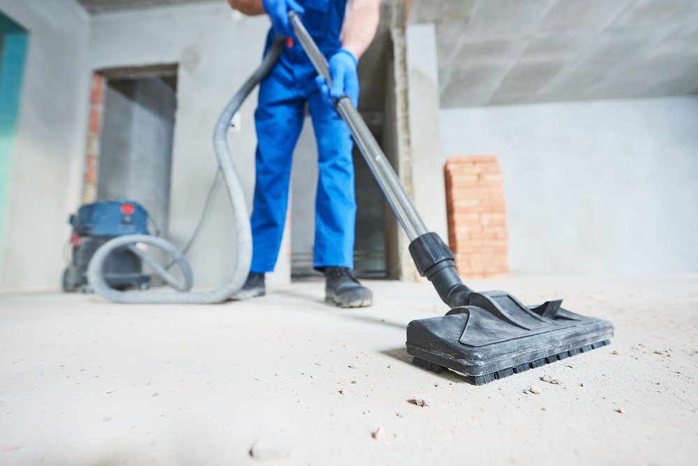 Vacuuming construction debris in a renovated room